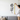 Person measuring a blank living room wall above a sofa to determine wall art dimensions
