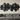 Large abstract metal art piece hanging in a modern living room