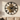 Large metal wall clock above a sofa in a bright living room