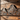 Iron wall sculpture with mountain design on exterior wall