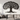 Spacious living room with a large iron tree of life wall sculpture above a sofa, sunlight streaming through windows