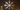 Metal snowflake wall ornament casting shadows on living room wall