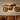 Motorcycle metal wall art above a sofa in a man cave