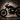 Metal motorcycle silhouette wall art casting a shadow in a man cave