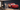 Metal silhouette of Lightning McQueen on a dark accent wall in a living room