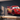 Metal silhouette of Lightning McQueen on a dark accent wall in a living room