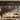 Living room with metal music wall decor featuring a band logo