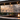 Outdoor patio bar with custom metal wall sign mounted above the countertop