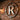 Tattoo shop interior with custom metal logo sign on brick wall