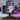Anime metal posters above gaming setup