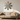 Metal snowflake wall ornament in a sunlit living room