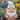 Personalized garden gnome with custom name sitting in a flower bed with lavender
