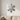 Metal snowflake wall ornament above a sofa in a living room