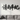 Large iron wall sculpture above a sofa in a bright living room
