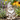 Metal custom garden gnome stake among flowers