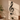 Metal treble clef wall decor casting shadows in a sunlit living room