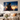 Living room wall with metal anime art above sofa