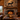 Rustic cabin living room with metal elk wall art above fireplace