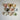 A collection of colorful ceramic bowls arranged on a white textured surface.