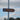 Toilet signpost outdoors with arrow pointing the way under a blue sky.