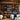 Chic restaurant interior with a comprehensive wine collection on display.