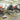 Motorcycle repair shop featuring Ducati, Honda, and Kawasaki bikes on stands.