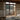 Traditional Japanese bedroom with wooden furniture and sliding doors overlooking a scenic view.