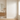AI-generated coastal bathroom concept with a lighthouse visible outside the window