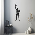 Load image into Gallery viewer, Silhouette Of A Basketball Player Raising A Ball In The Air Metal Wall Decor
