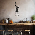 Load image into Gallery viewer, Silhouette Of A Basketball Player Raising A Ball In The Air Metal Wall Decor
