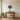 Acorn ring wall art hanging above an open kitchen shelf