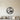 Round metal wall art of two avocado halves leaning together