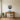 Stepped pyramid wall art above a living room sofa