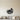 Bird nest metal wall art with a small bird perched beside a clutch of eggs