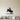 Black steel silhouette of a bucking bull and rider