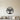 Menorah design with lit candles and scrollwork inside a circle
