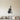Black steel cello silhouette with the bow leaning against it