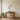 Circling swallows wall art hanging above a sofa in a living room