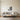Climber Pulling Up a Faceted Cliff Metal Wall Art hung in a home office