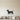 Black steel silhouette of a dachshund standing in profile