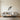 Diving falcon wall art hanging above a desk in a home office