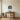 Evergreen Stand at the Forest Edge Metal Wall Art hung in a living room