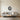 Faceted crescent moon metal art in a bedroom