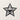 Front view of the faceted star design on a plain wall