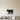 Black steel silhouette of a farm pig with a curly tail