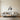 Fishing rod and bass metal wall art hanging on a home office wall