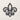 Front view of the fleur de lis outline design on a plain wall