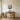 Flying geese and cattails metal wall art hanging above a sofa in a living room