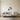 Geometric orchid wall art hanging above a tub in a bathroom