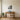 Geometric buck and tree stand wall art above a couch in a living room